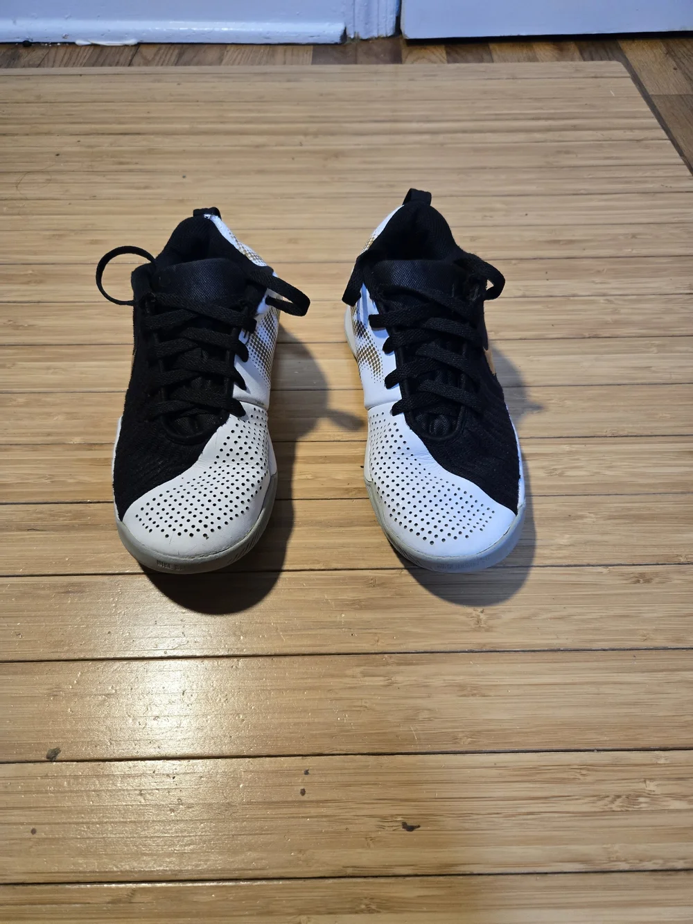 Nike Boy Black and White Basketball Shoes with Gold Accents